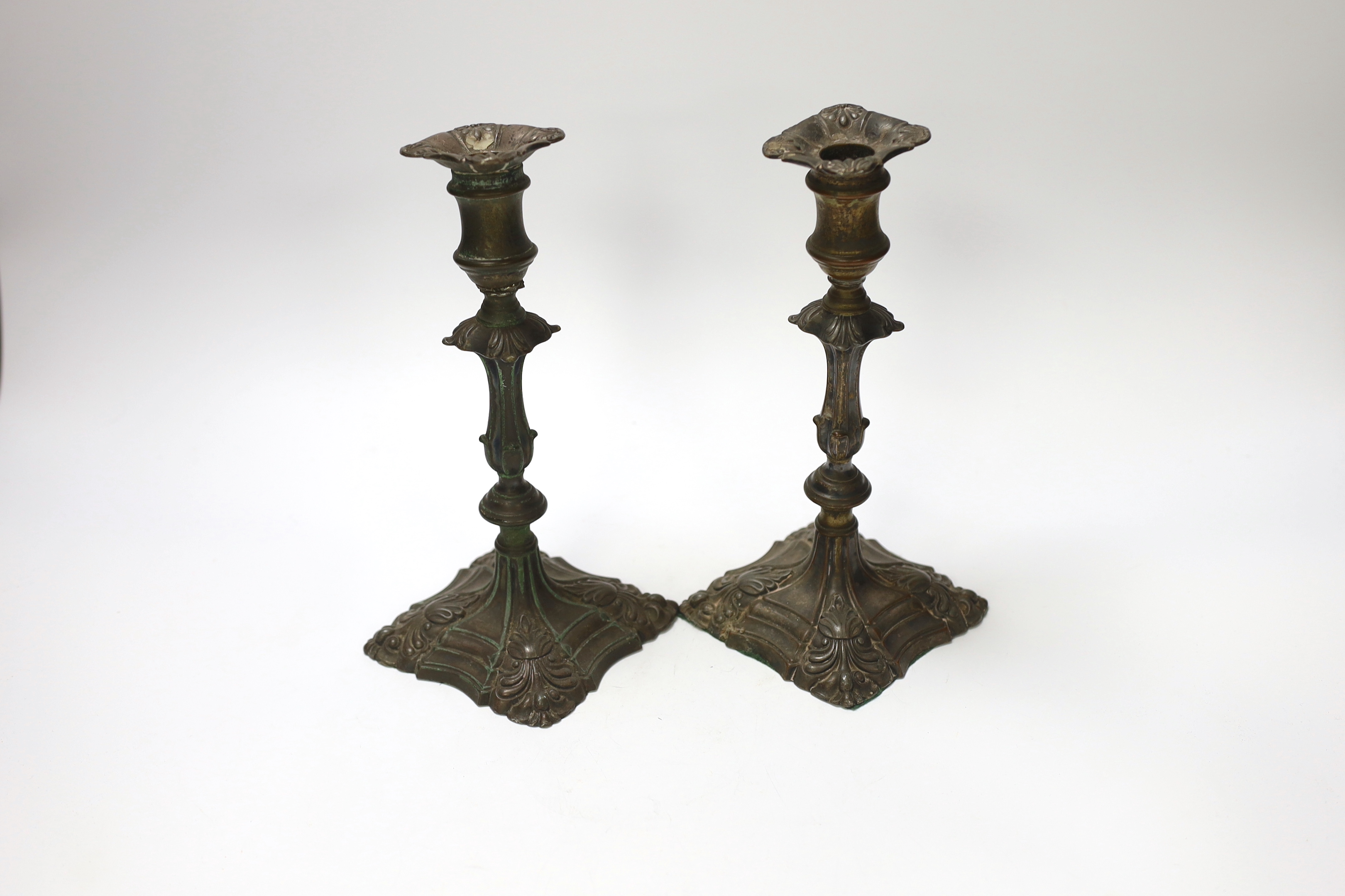 A pair of late 18th century Old Sheffield plate candlesticks, 24cm high